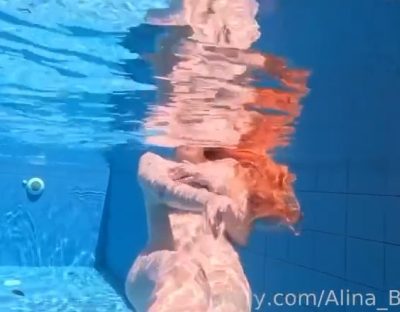 Alina Becker swimming naked in the pool